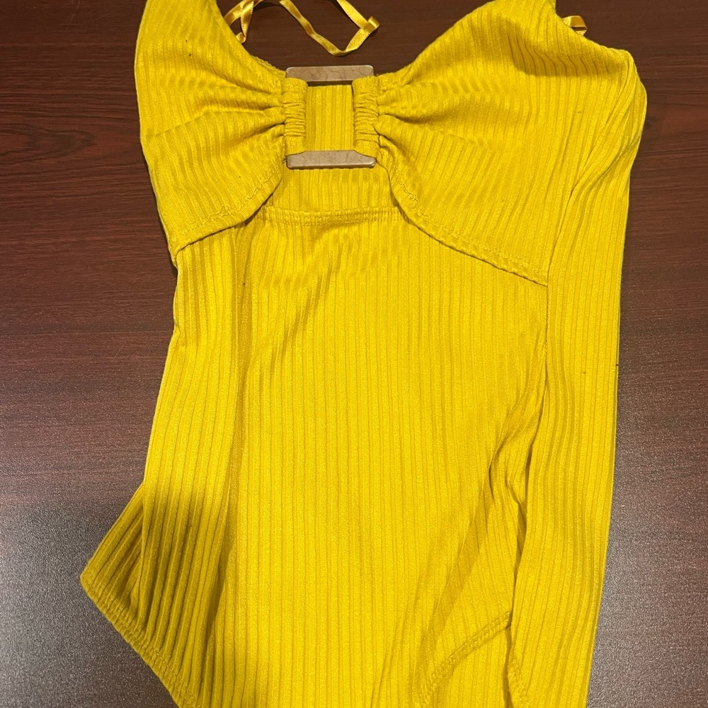 Yellow bodysuit with wooden detail